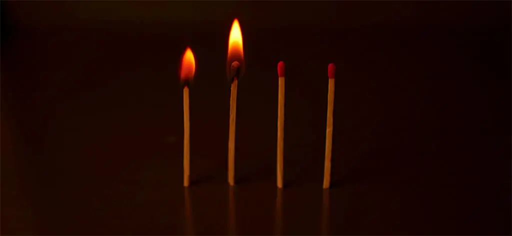 two lit matches to symbolize the season of waiting