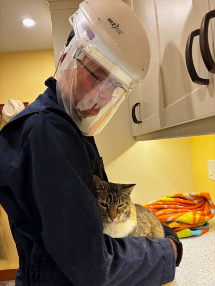 man holding cat